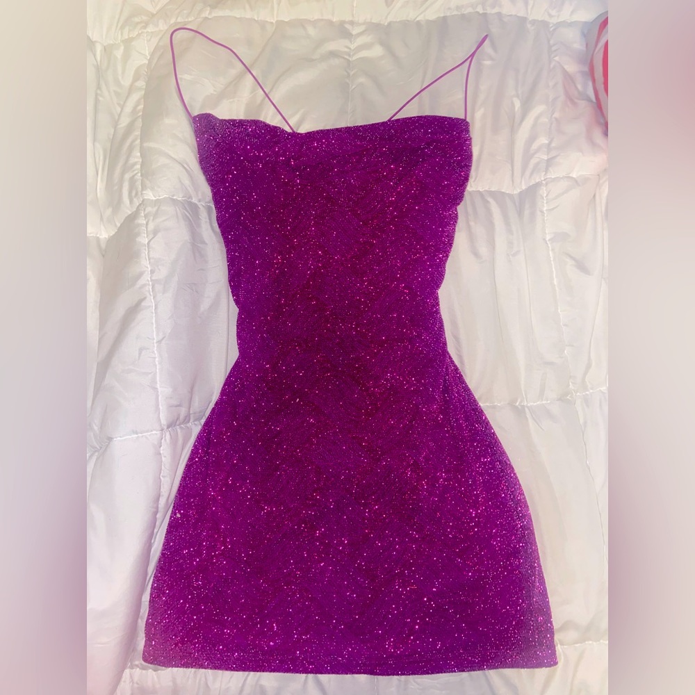 Size is medium (6), has a low back cut, sparkly, and goes to mid-thigh.
